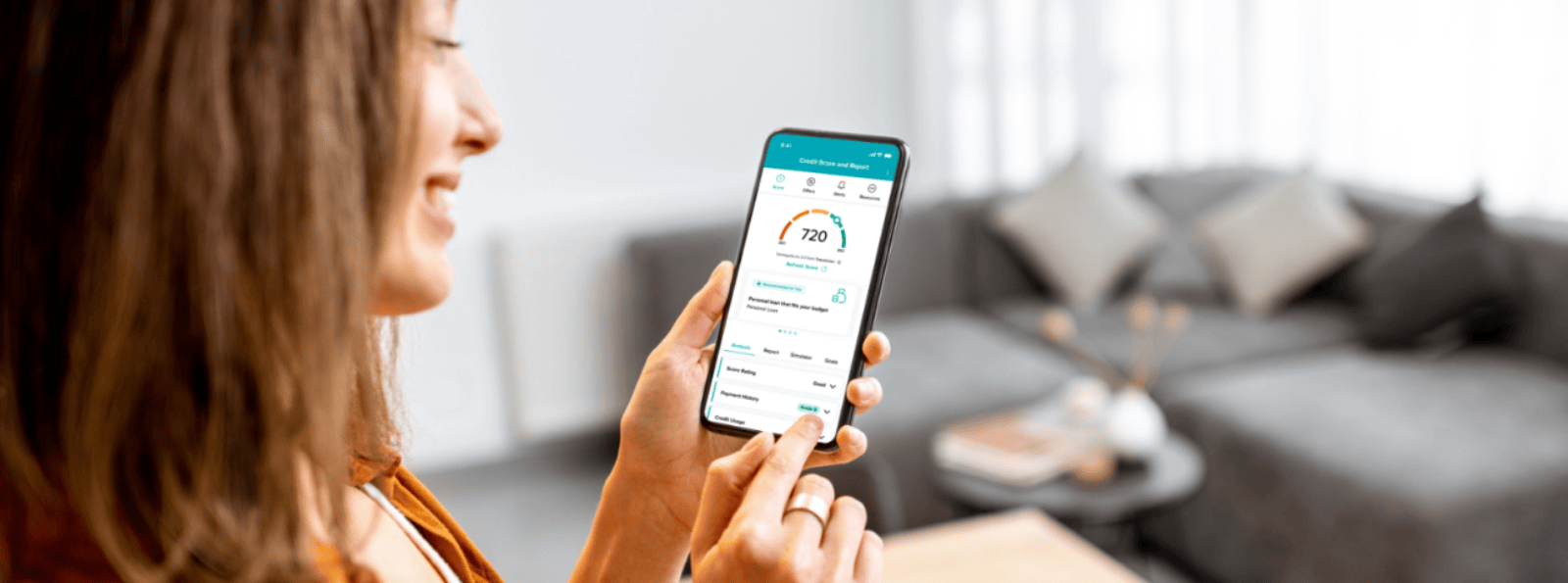 Woman checking her credit score on her mobile device