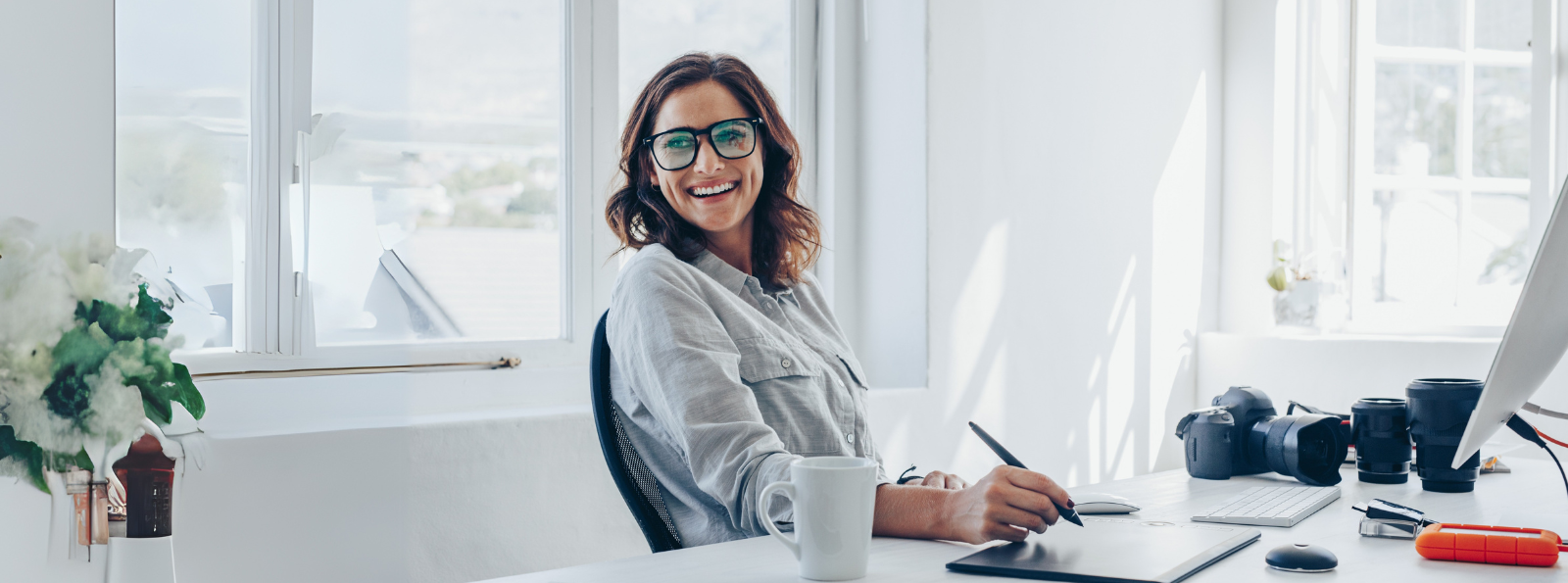 Woman smiling at desk
