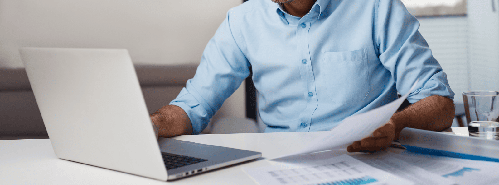 Man paying bills on his laptop