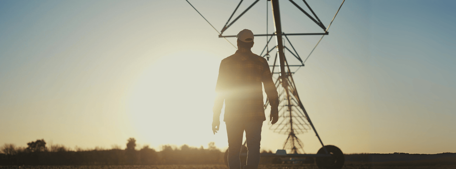 Farmer walking pivot line