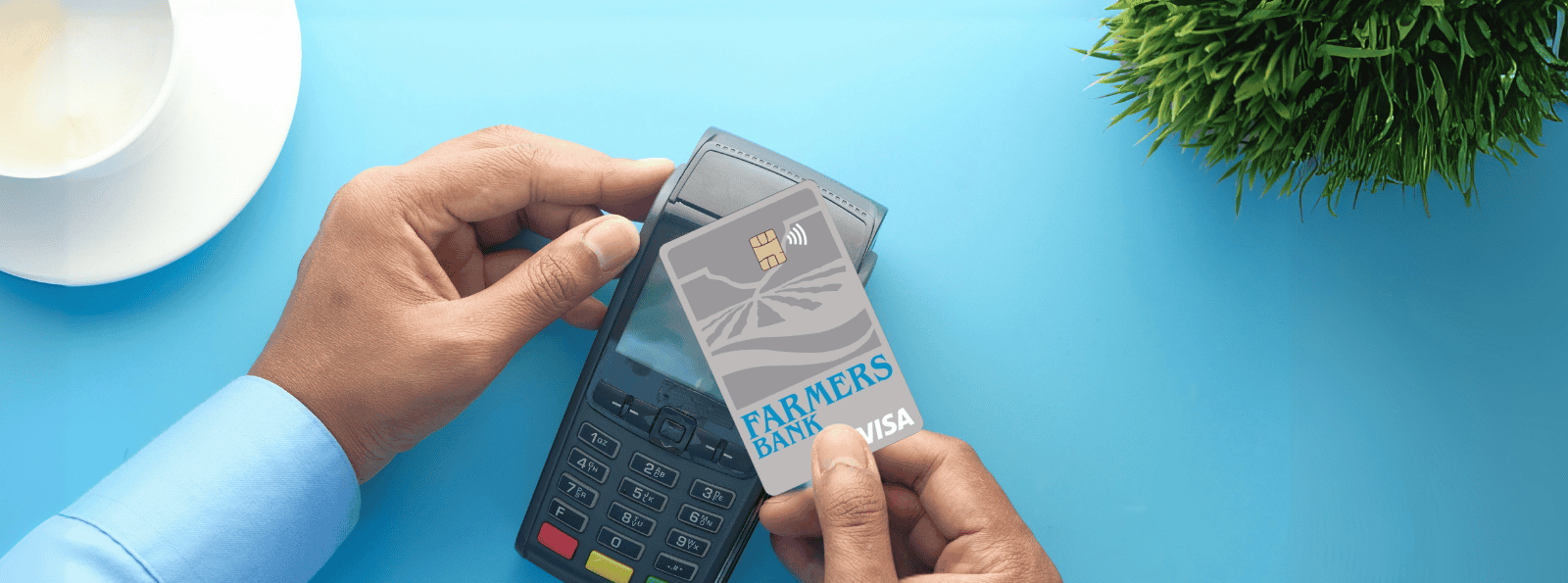 Man paying at terminal with Farmers Bank Business Credit Card